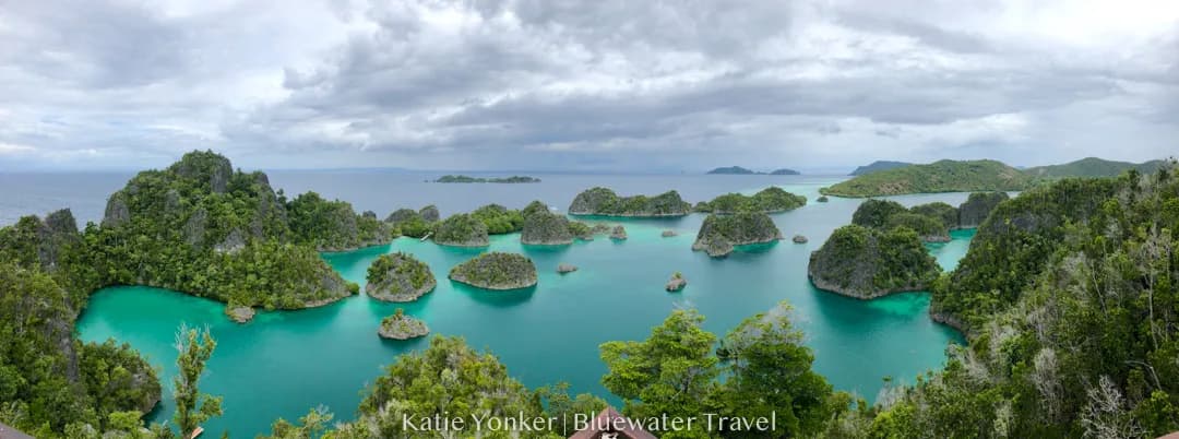 A view of Raja Ampat's emerald islands dotting the turquoise sea. A view of Raja Ampat's emerald islands dotting the turquoise sea.