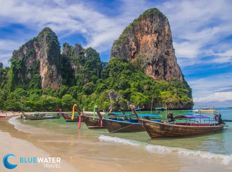 Wooden boats and limestone karsts at Railay Beach in Thailand.