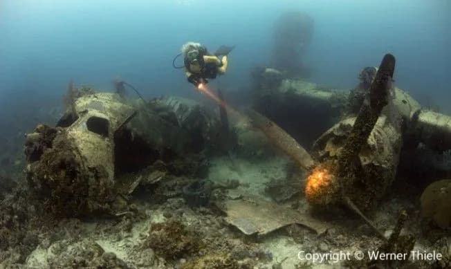 A scuba diver explores Truk Lagoon