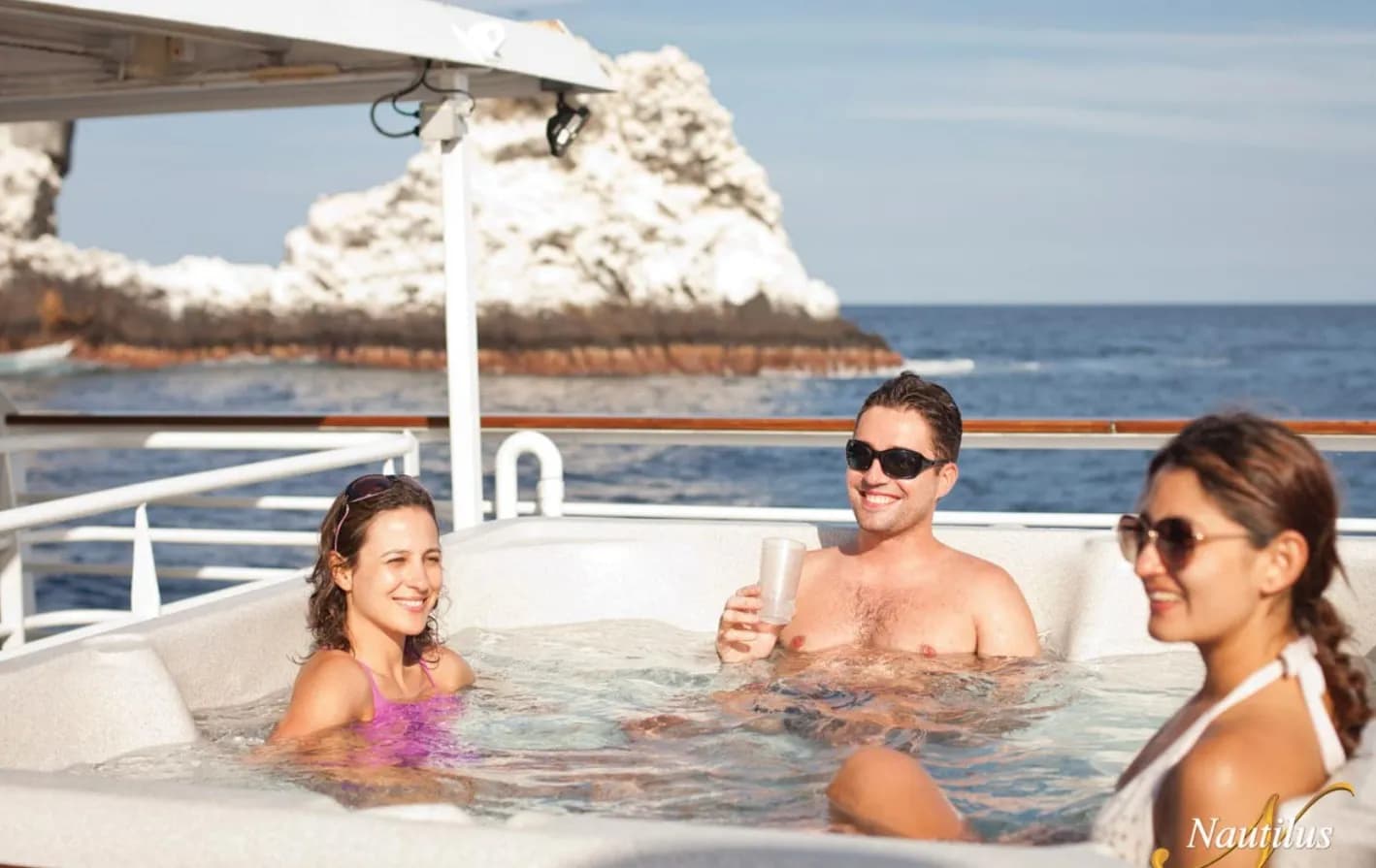 Guests lounge in the hot tub