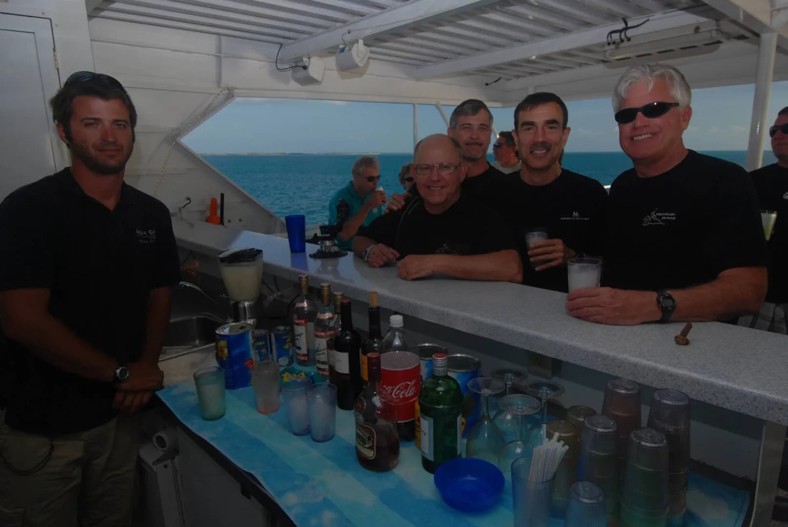 People congregate at the bar aboard Aqua Cat Cruises