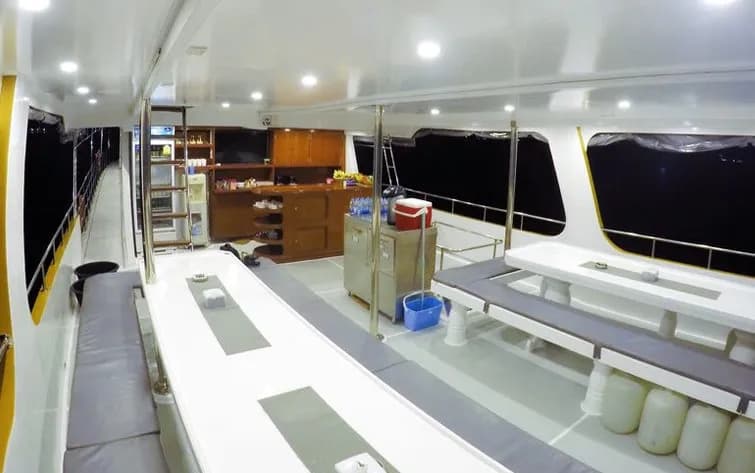 The indoor dining area with benches and tables