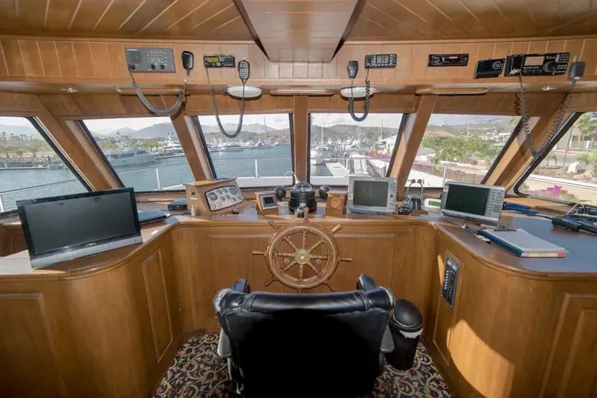 Helm of the Rocio del Mar Liveaboard featuring a steering wheel and navigation computer.