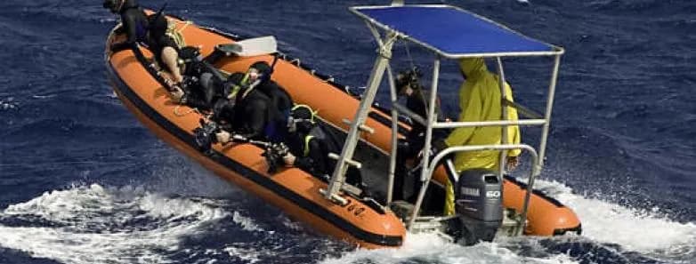 The dive tender on the water
