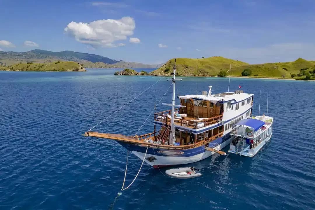 Komodo Sea dragon liveaboard anchored in a resting sea.