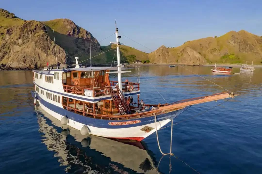Komodo Sea Dragon Liveaboard anchored with beautiful background scenery of Komodo National Park