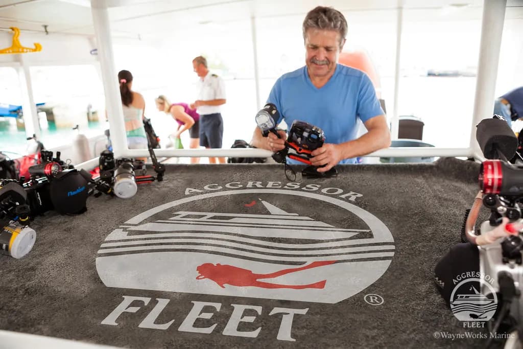 People prepare at a camera station aboard the Bahamas Aggressor.