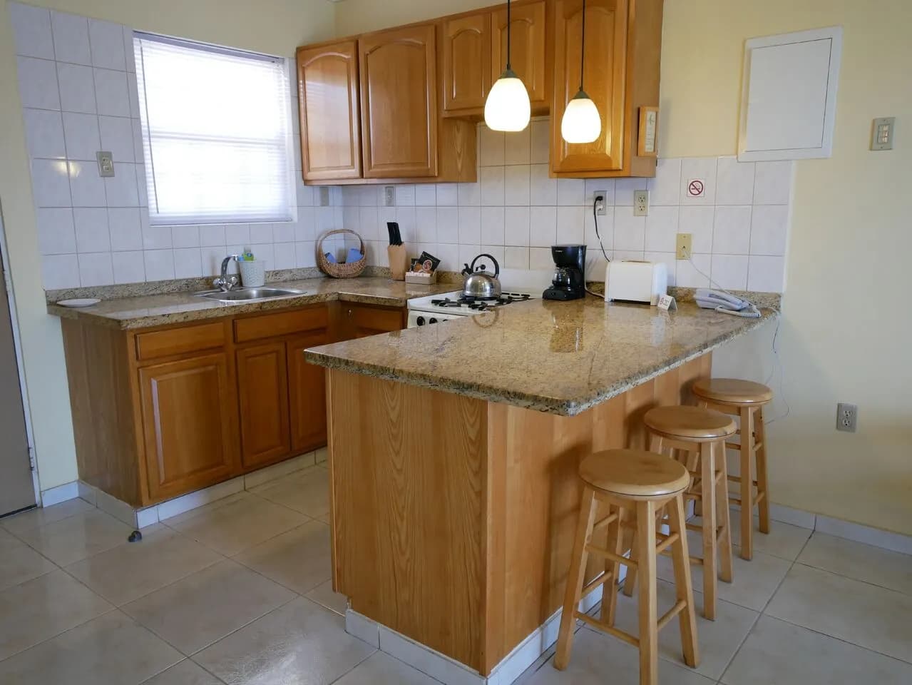 A kitchen with a countertop and a sink.