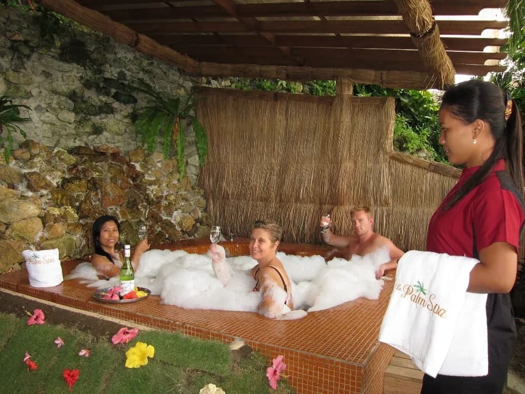 People drink wine in a bubble bath at the spa at El Galleon