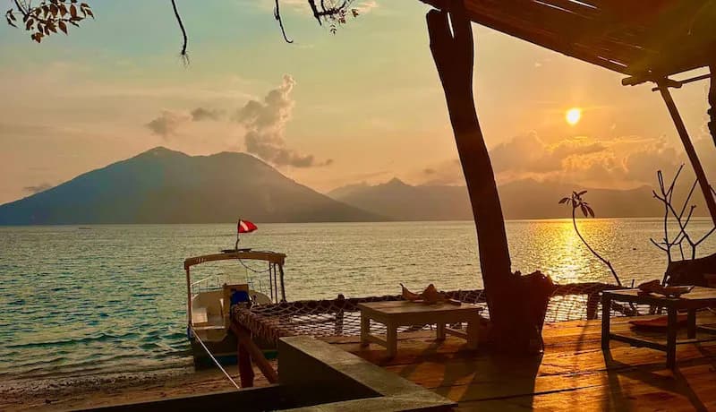 The sun goes down in front of the resort